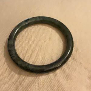 Solid Jade bangle bracelet.  Fits over hand.  Beautiful Jade.
